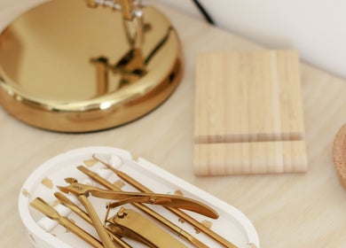Elegant gold beauty tools displayed at Gloss by Storm in Bowbrook, England, GB. Perfect for a luxurious experience.