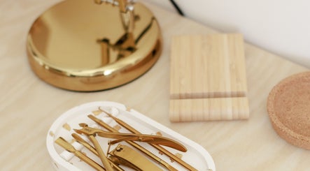 Elegant gold beauty tools displayed at Gloss by Storm in Bowbrook, England, GB. Perfect for a luxurious experience.