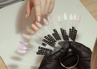 Gloss by Storm in Bowbrook offers a selection of nail colors on display for manicures.