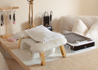 Elegant nail station at Gloss by Storm, Bowbrook, England, GB, showcasing tools and cozy seating.