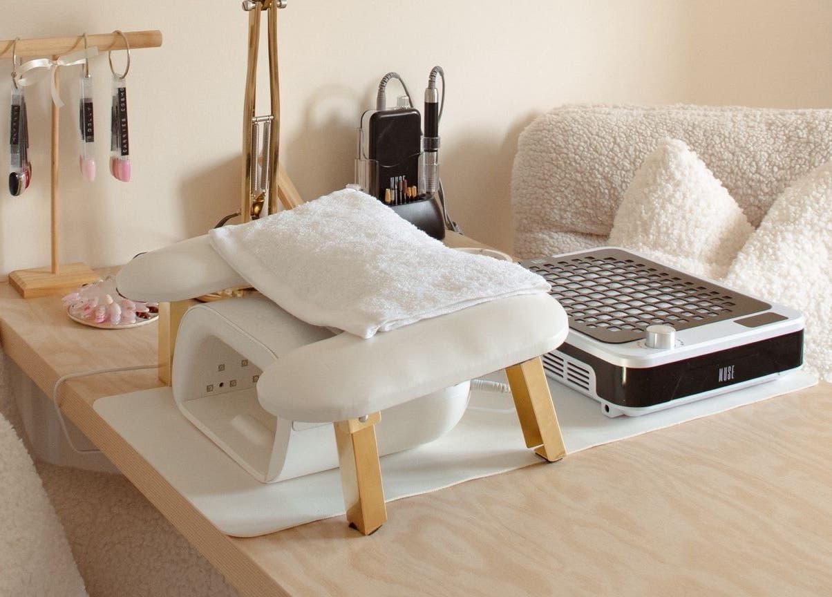 Chic nail desk at Gloss by Storm, Bowbrook, England, GB, featuring white accents and manicure tools.