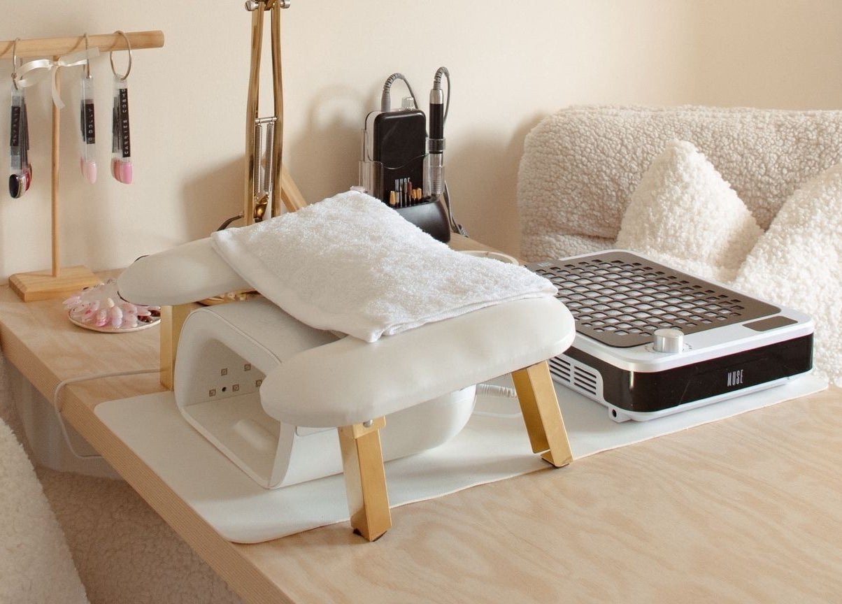 Chic nail desk at Gloss by Storm, Bowbrook, England, GB, featuring white accents and manicure tools.