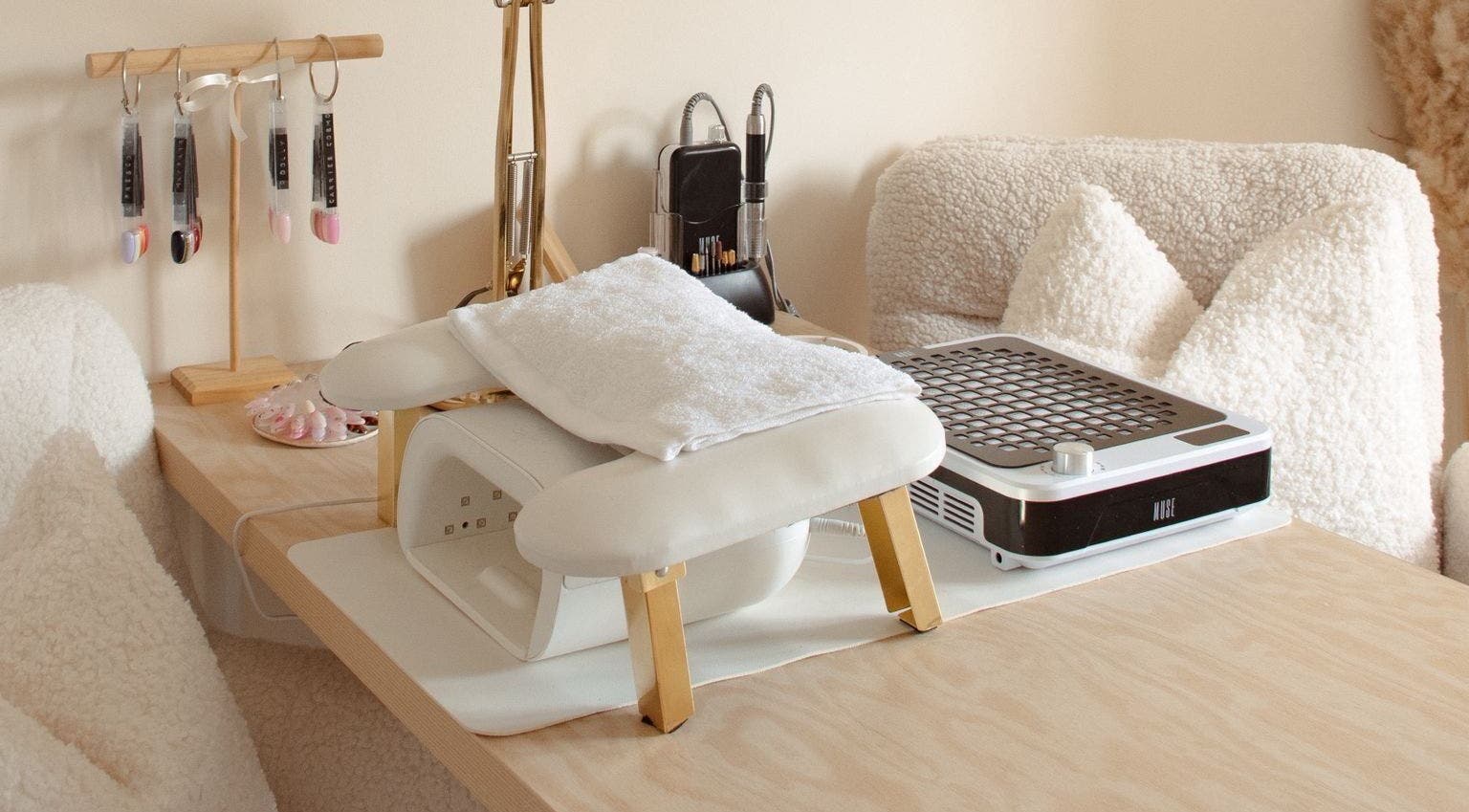 Chic nail desk at Gloss by Storm, Bowbrook, England, GB, featuring white accents and manicure tools.