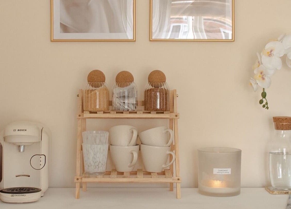 Calming coffee nook at Gloss by Storm, Bowbrook, England, GB with mugs, jars, and orchids.