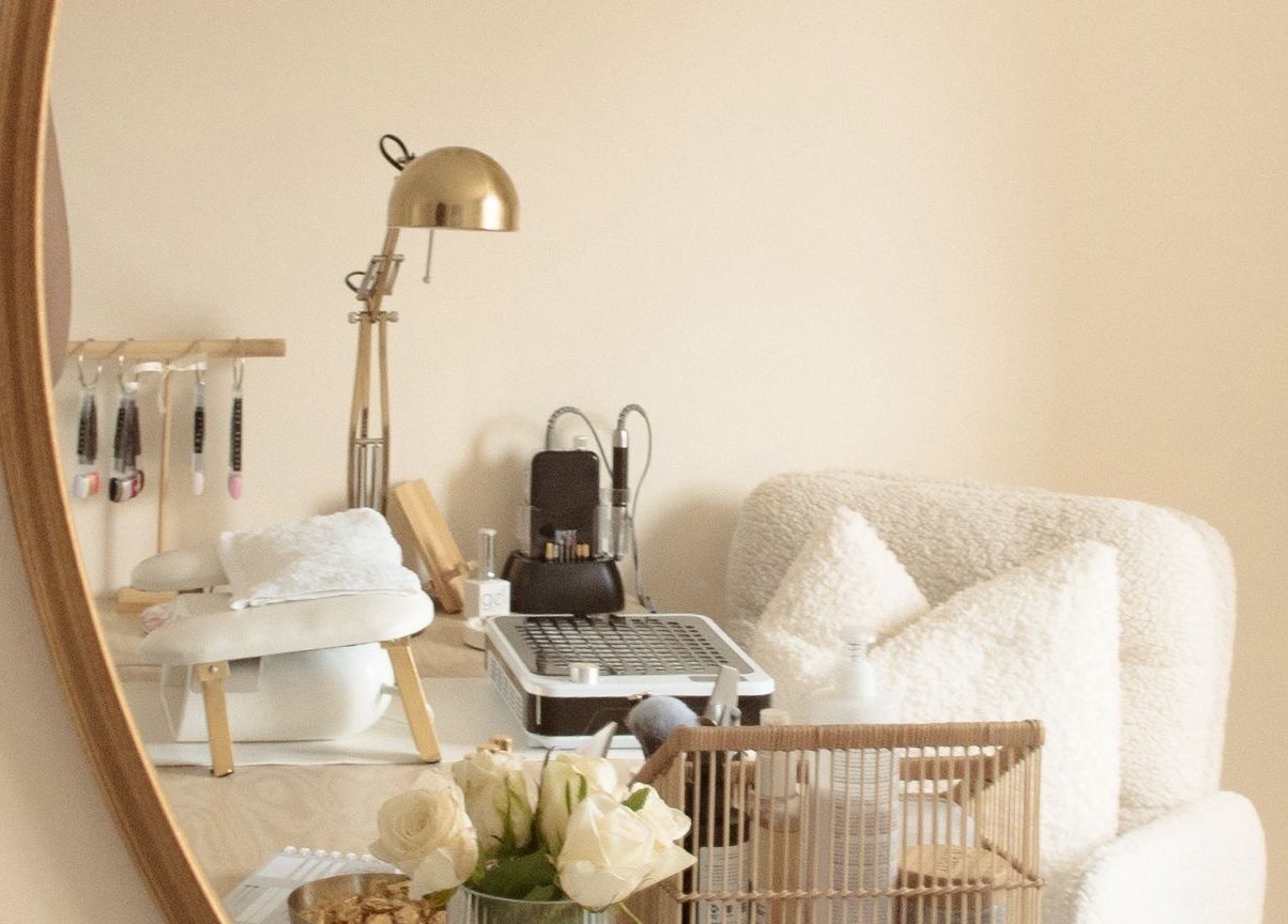 Elegantly decorated beauty workspace at Gloss by Storm, Bowbrook, England, GB with soft furnishings and flowers.