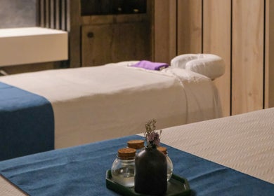 Tranquil massage room at Pamper Valley in Toronto, Ontario, CA, featuring cozy beds and ambient lighting.