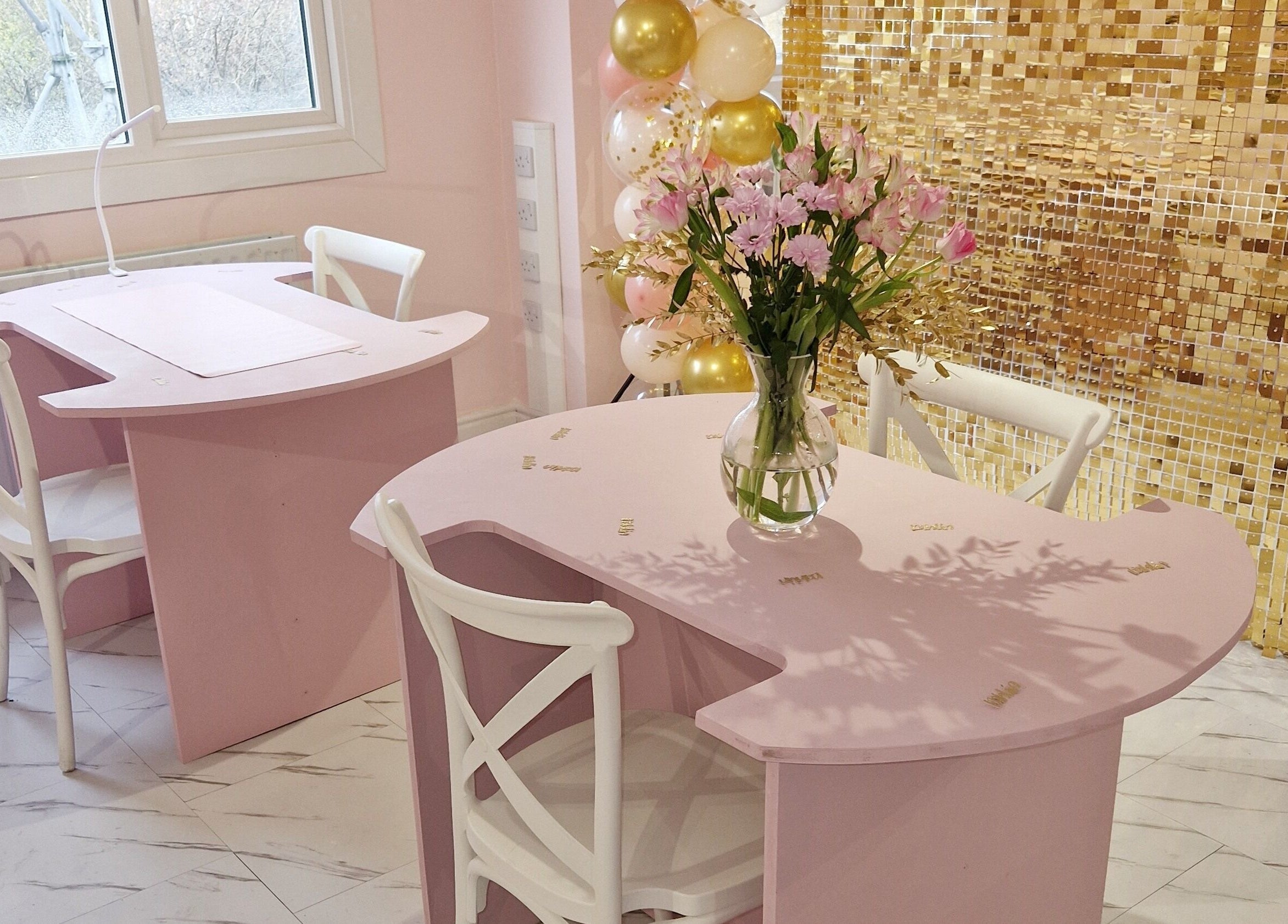 Chic pink nail stations and flowers at Nordik Aesthetics @ Dahlin, Sandbach, England, GB with gold decor.