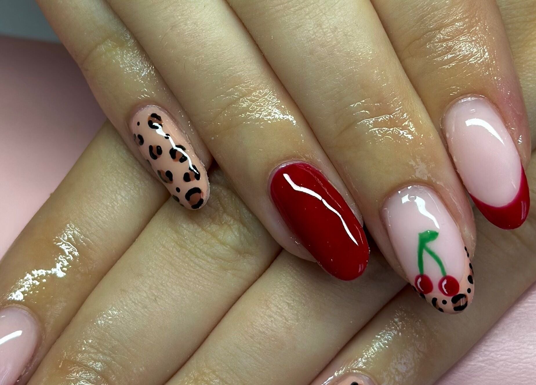 Elegant nail art design at Nails By CC, Chorley, England, GB showcasing red, cherry, and leopard motifs.