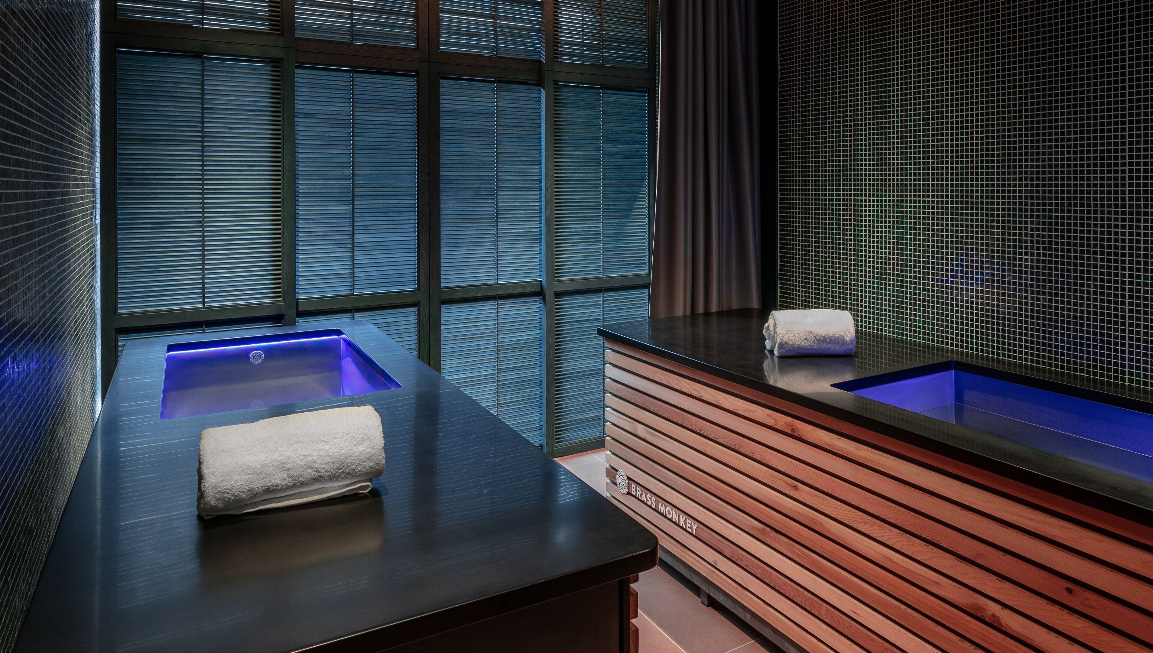 Luxurious spa room at Lost/Found Spa, Hong Kong Island, featuring ambient lighting and a serene bath setup.