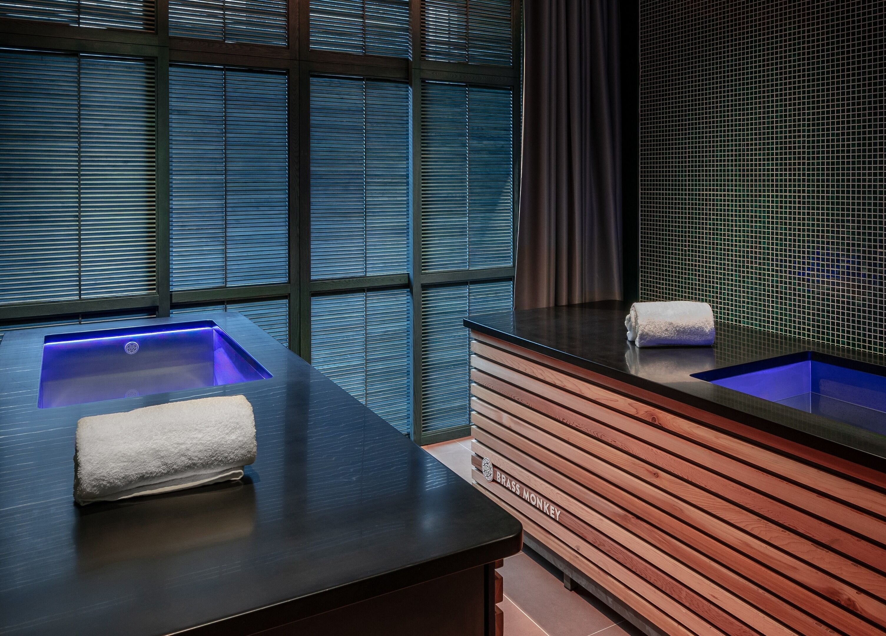 Luxurious spa room at Lost/Found Spa, Hong Kong Island, featuring ambient lighting and a serene bath setup.