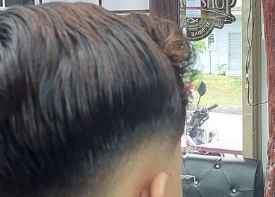 Modern haircut at Otai Barber Studio, Seberang Jaya, Penang, MY, featuring a sleek undercut style.