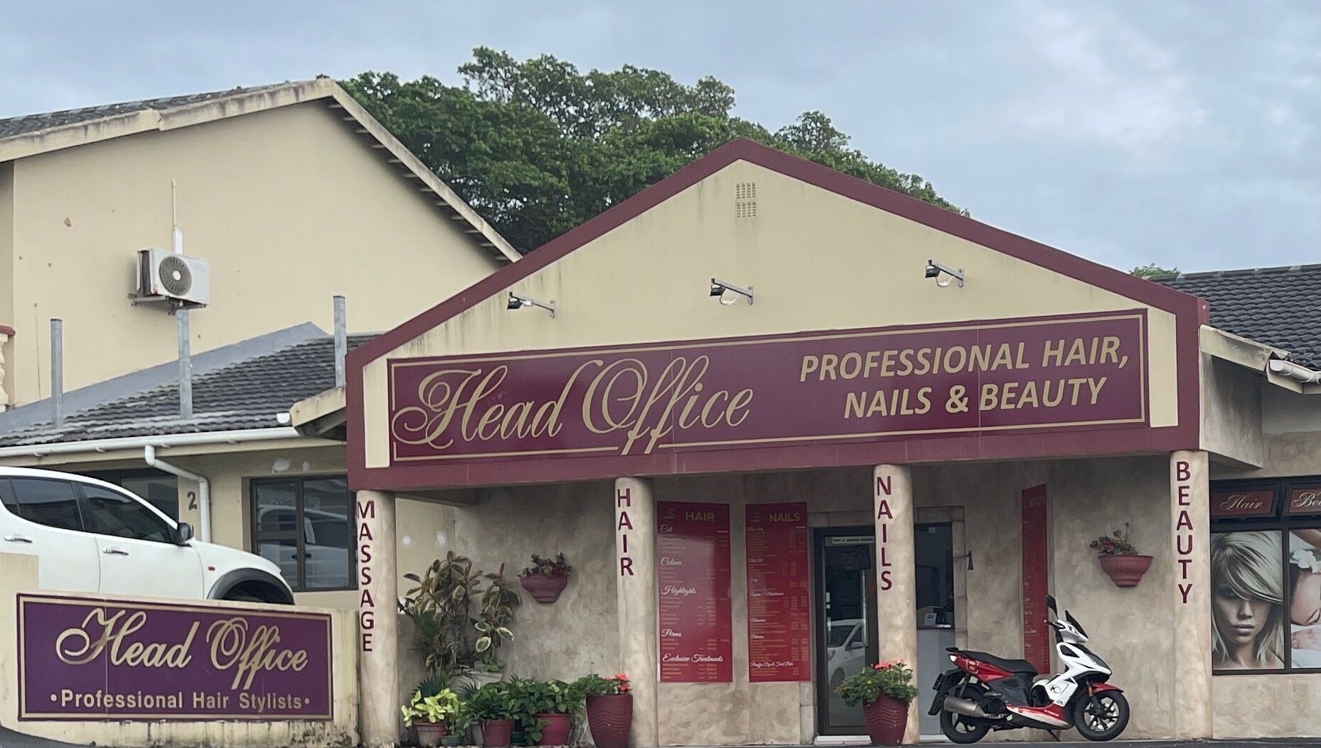Entrance of Head Office Professional Hair, Nails and Beauty Uvongo in Margate, Kwa-Zulu Natal, ZA with vibrant signage.