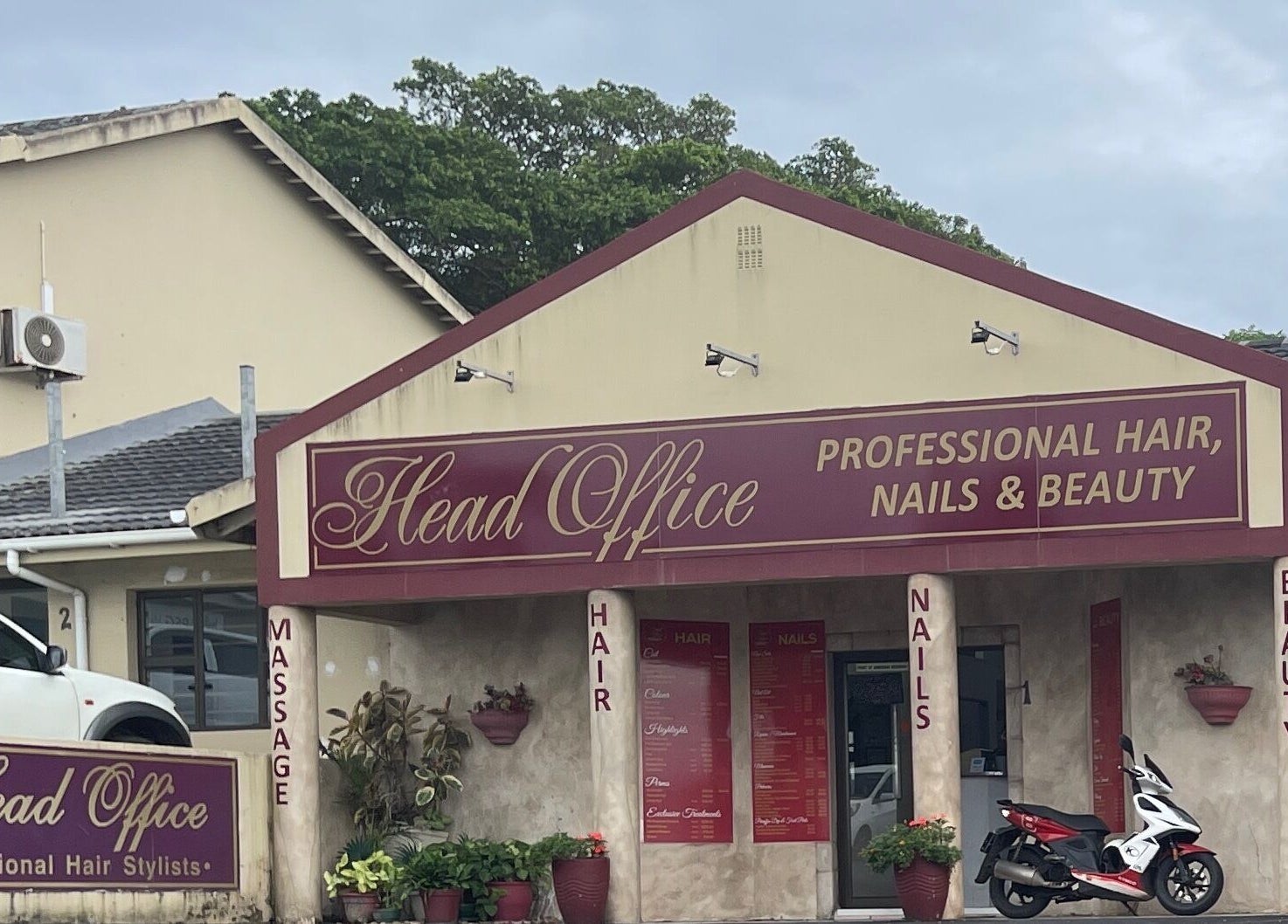 Entrance of Head Office Professional Hair, Nails and Beauty Uvongo in Margate, Kwa-Zulu Natal, ZA with vibrant signage.
