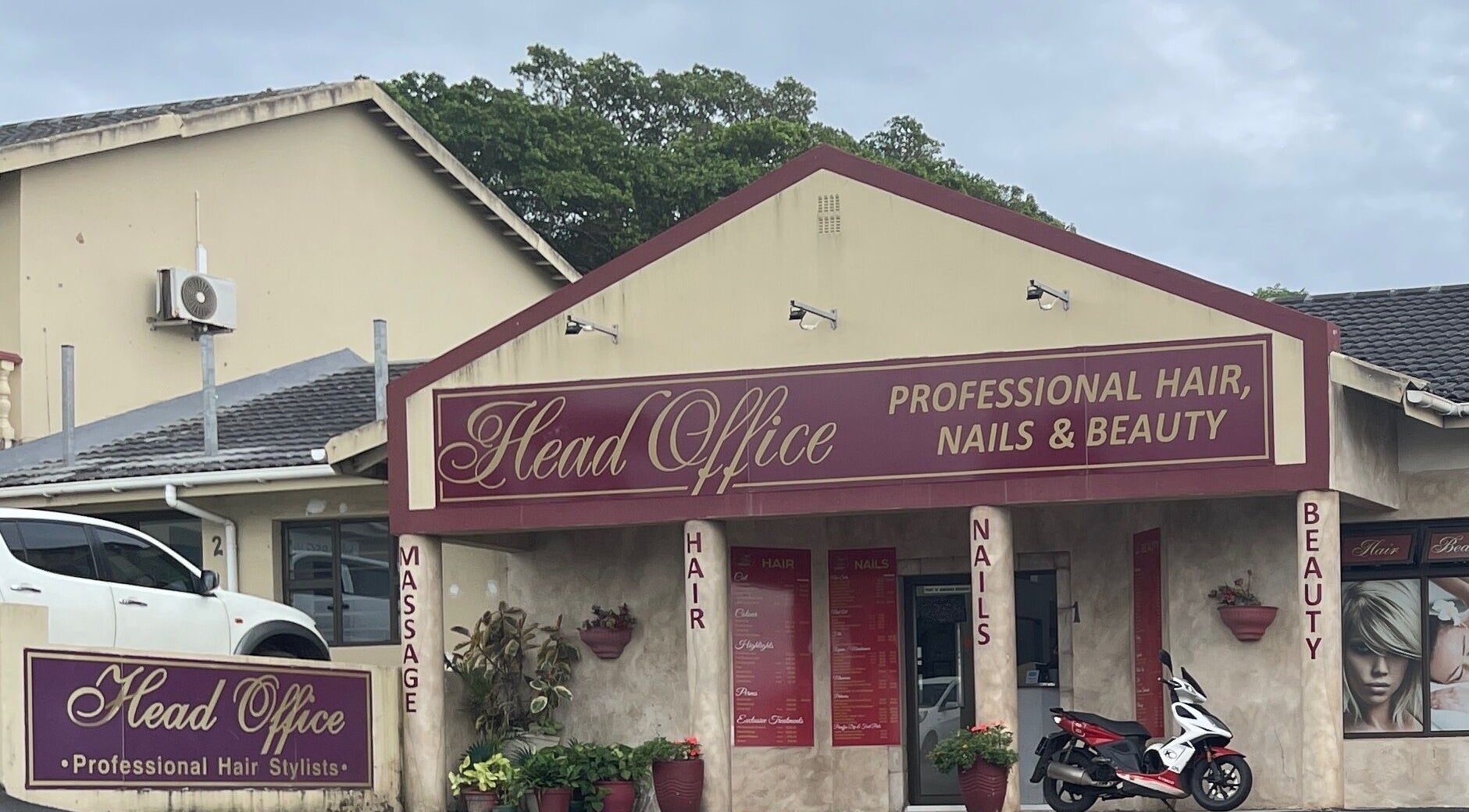 Entrance of Head Office Professional Hair, Nails and Beauty Uvongo in Margate, Kwa-Zulu Natal, ZA with vibrant signage.