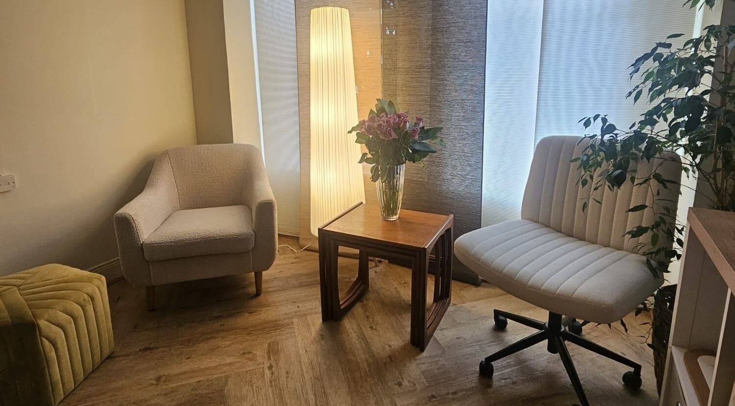 Inviting lounge area at Filly Green in Douglas, IM featuring comfortable chairs and elegant decor.