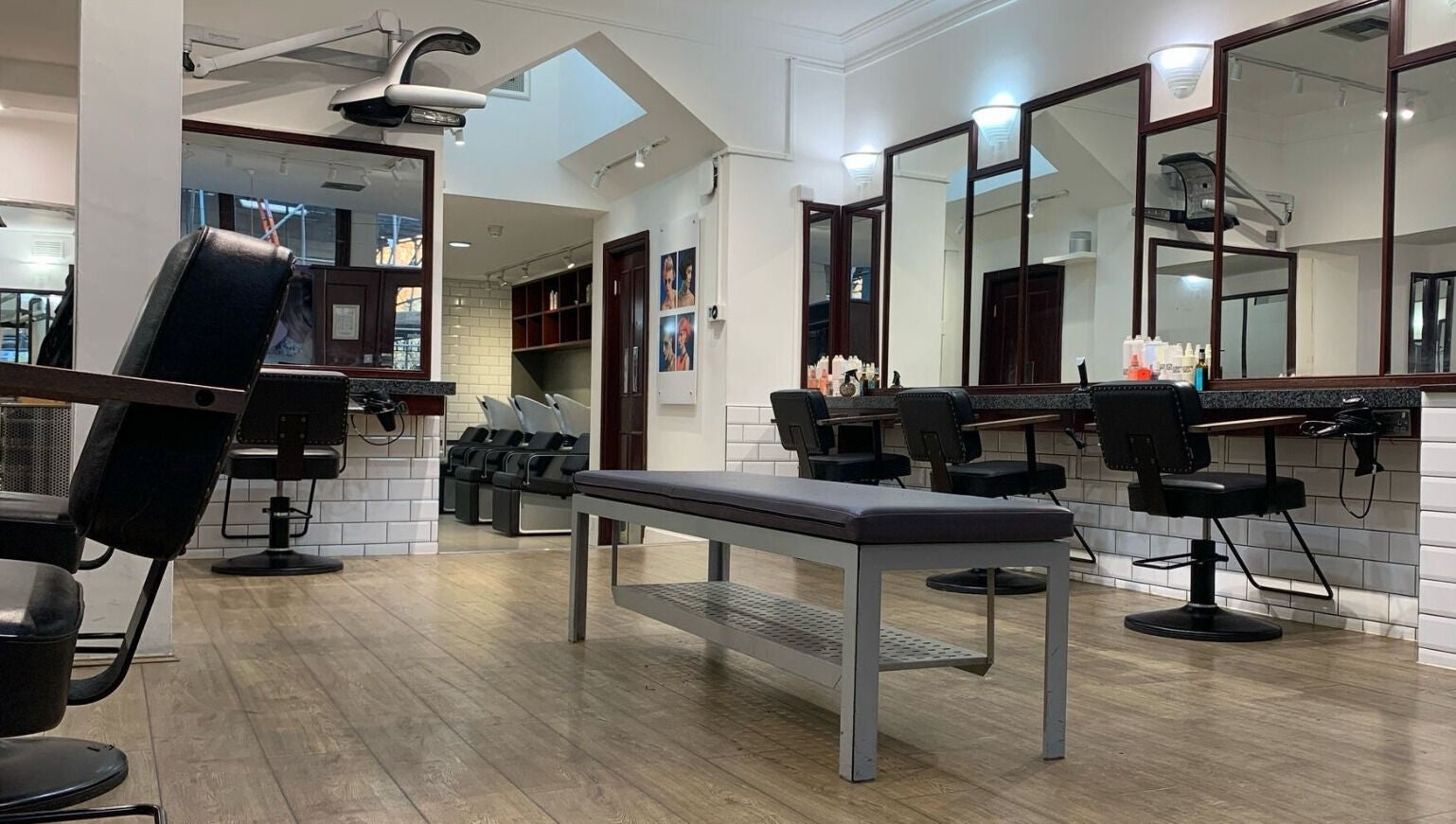 Modern salon interior at Mahogany Hair - Turl Street, Oxford, England, GB. Spacious, stylish, and inviting.
