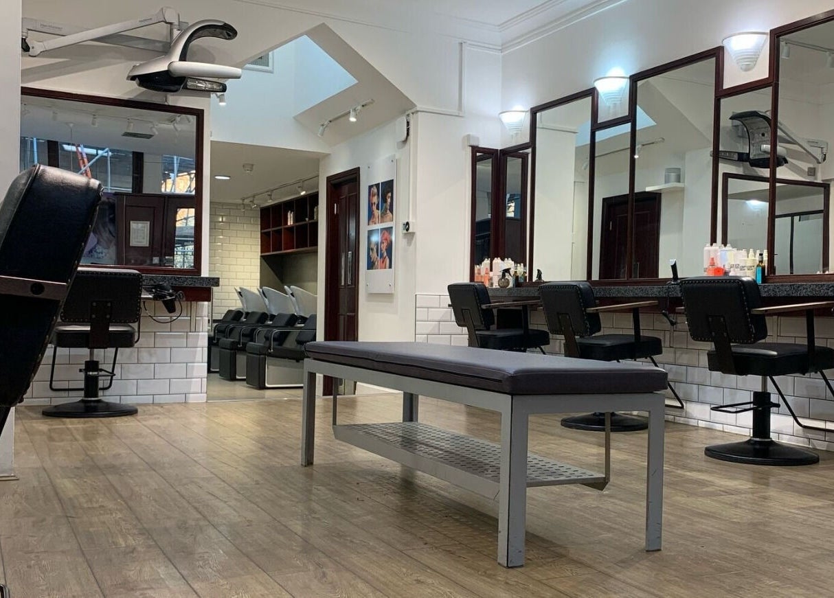 Modern salon interior at Mahogany Hair - Turl Street, Oxford, England, GB. Spacious, stylish, and inviting.