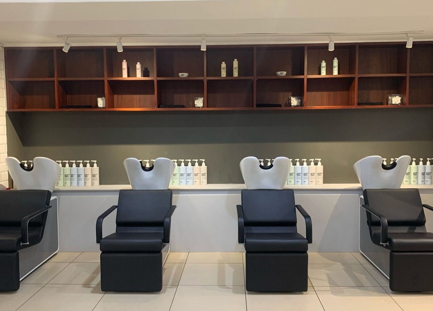Chic salon wash stations at Mahogany Hair - Turl Street, Oxford, England, GB, showcasing modern design.