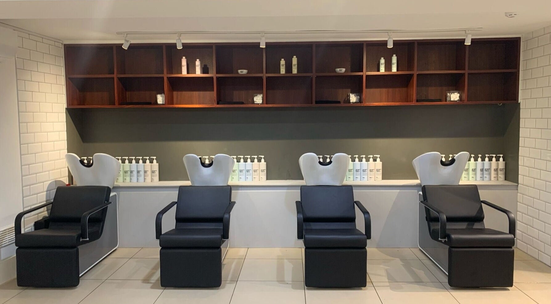 Chic salon wash stations at Mahogany Hair - Turl Street, Oxford, England, GB, showcasing modern design.