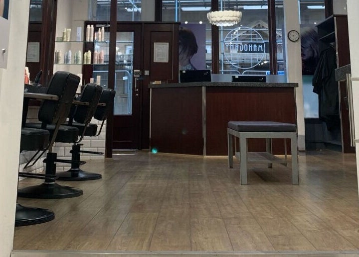 Mahogany Hair - Turl Street, a chic salon in Oxford, England, GB, featuring stylish chairs and modern decor.