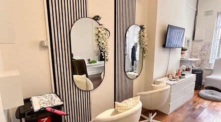 Elegant salon interior at Inches Hair, Dublin, County Dublin, IE with stylish mirrors and cozy seating.
