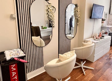 Stylish beauty salon interior at Inches By Alba, Dublin, County Dublin, IE, featuring mirrors and elegant decor.