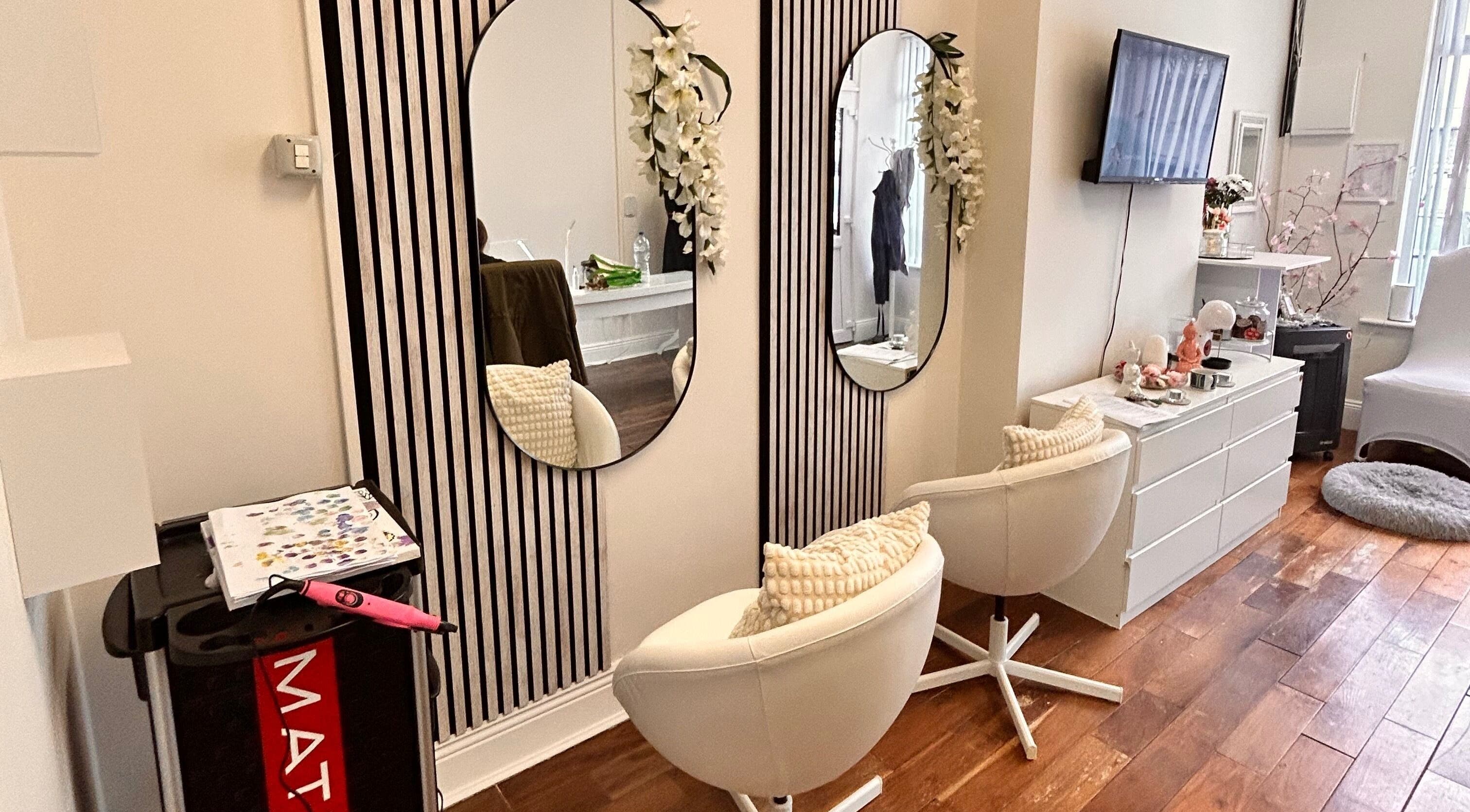 Stylish beauty salon interior at Inches By Alba, Dublin, County Dublin, IE, featuring mirrors and elegant decor.