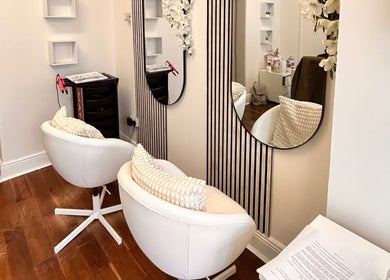 Elegant seating and mirrors at Inches By Alba, Dublin, County Dublin, IE, highlighting modern beauty vibes.