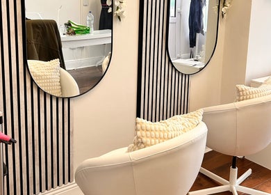 Modern salon chairs and mirrors at Inches By Alba, Dublin, County Dublin, IE, showcasing elegance and style.