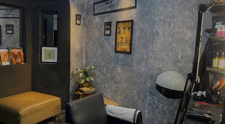 Cozy corner of Room41 Barber with modern decor and framed art in Klang, Selangor, MY.