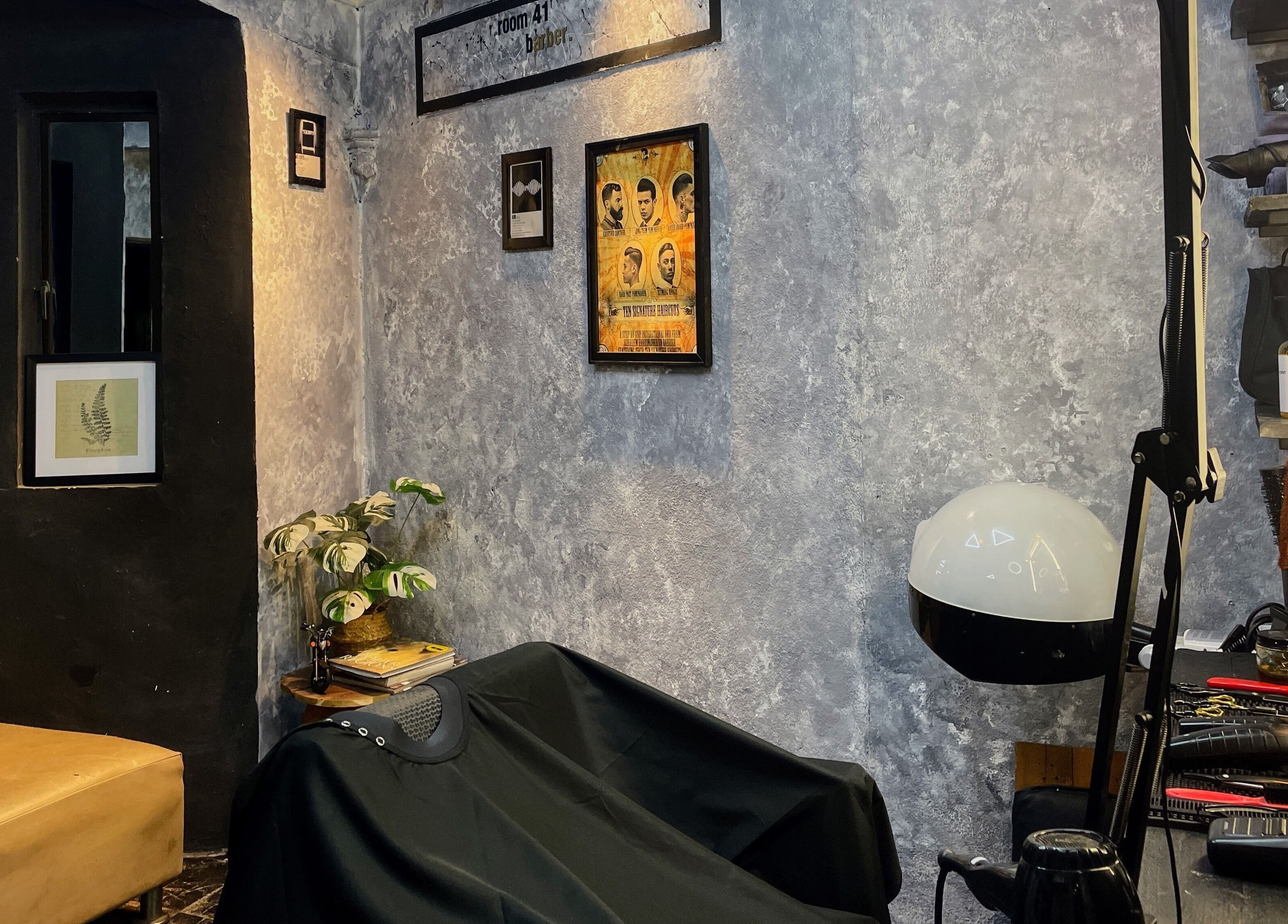 Cozy interior of Room41 Barber in Klang, Selangor, MY featuring a vintage-style setting with salon tools and wall art.
