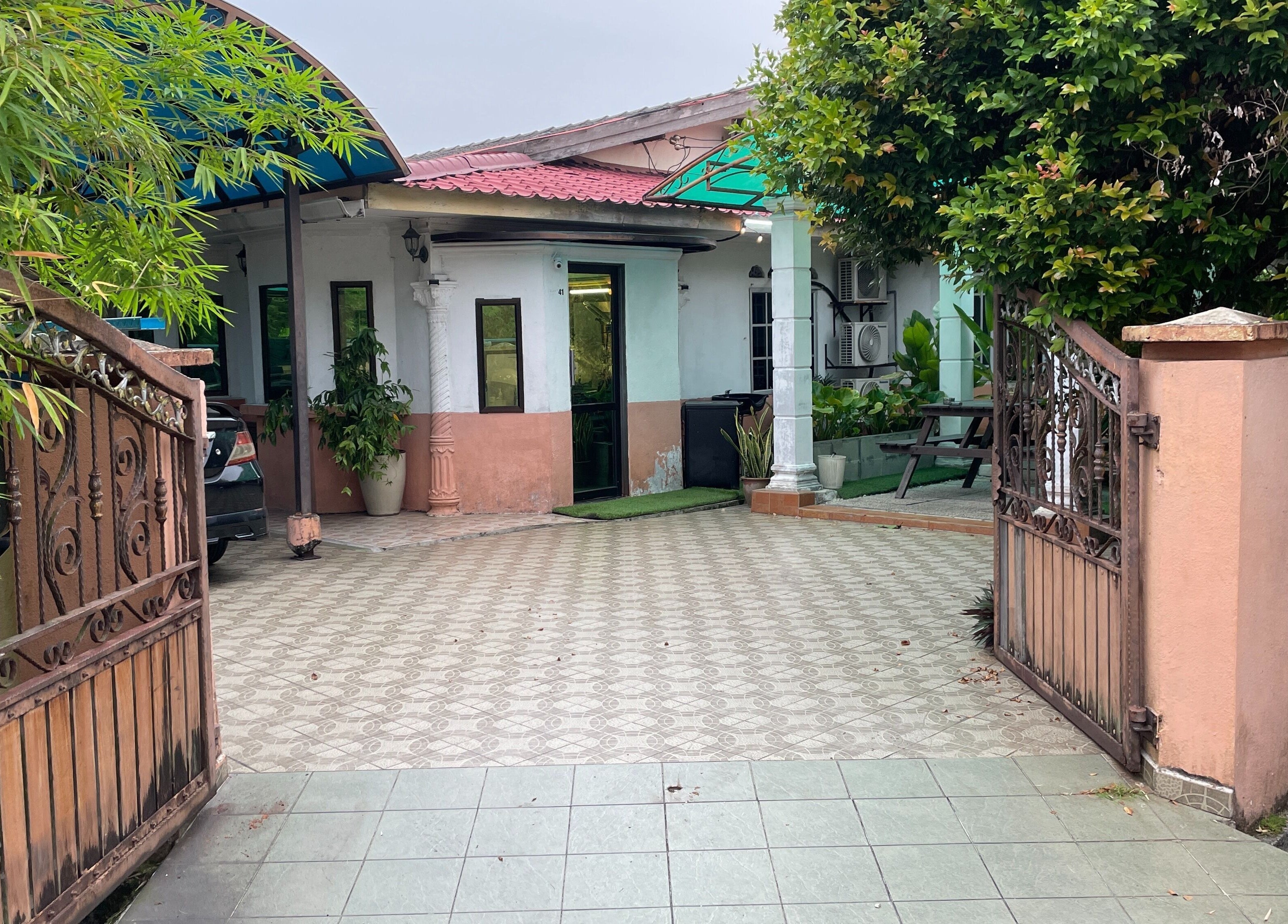 Entrance to Room41 Barber in Klang, Selangor, MY featuring an inviting open courtyard.