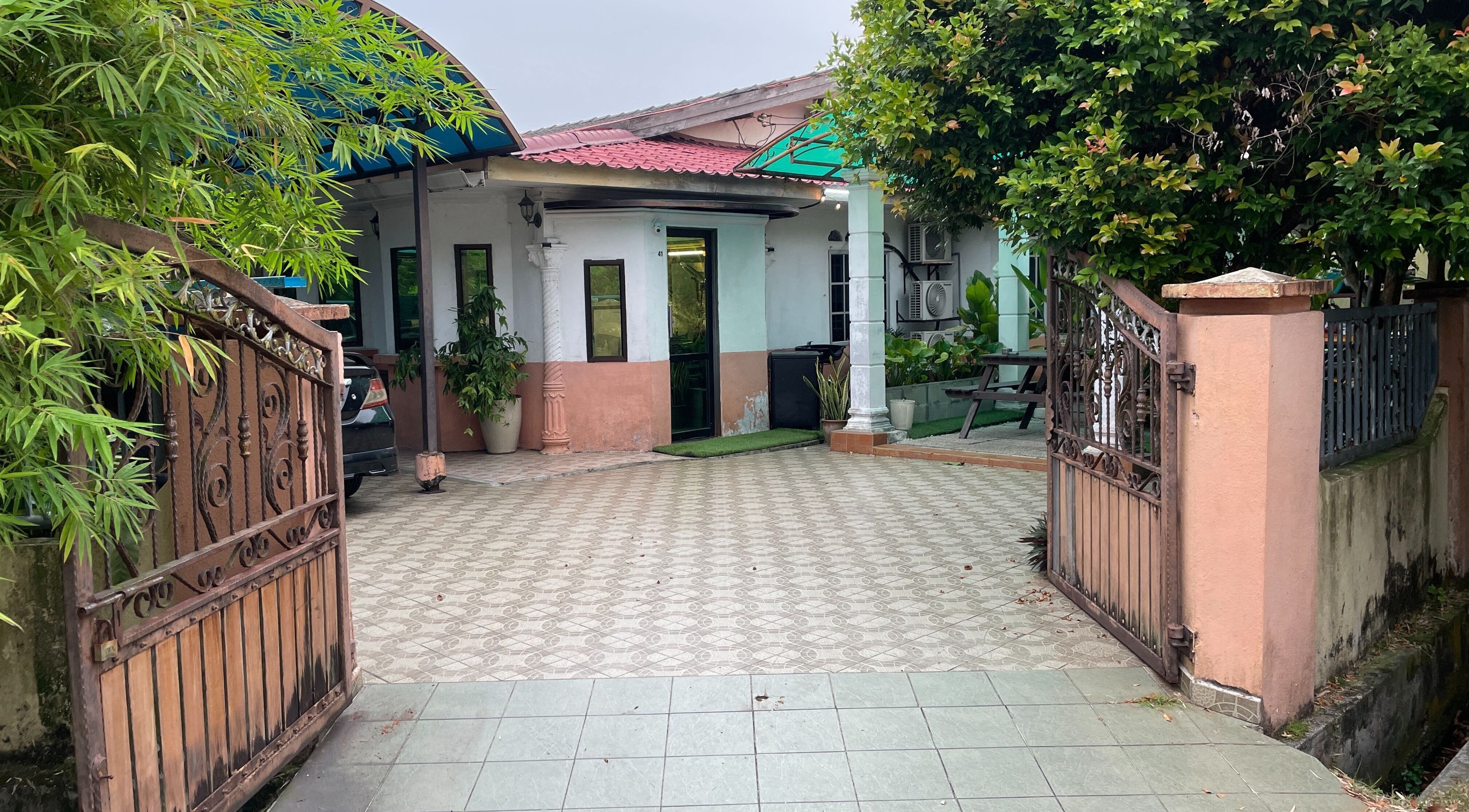 Entrance to Room41 Barber in Klang, Selangor, MY featuring an inviting open courtyard.