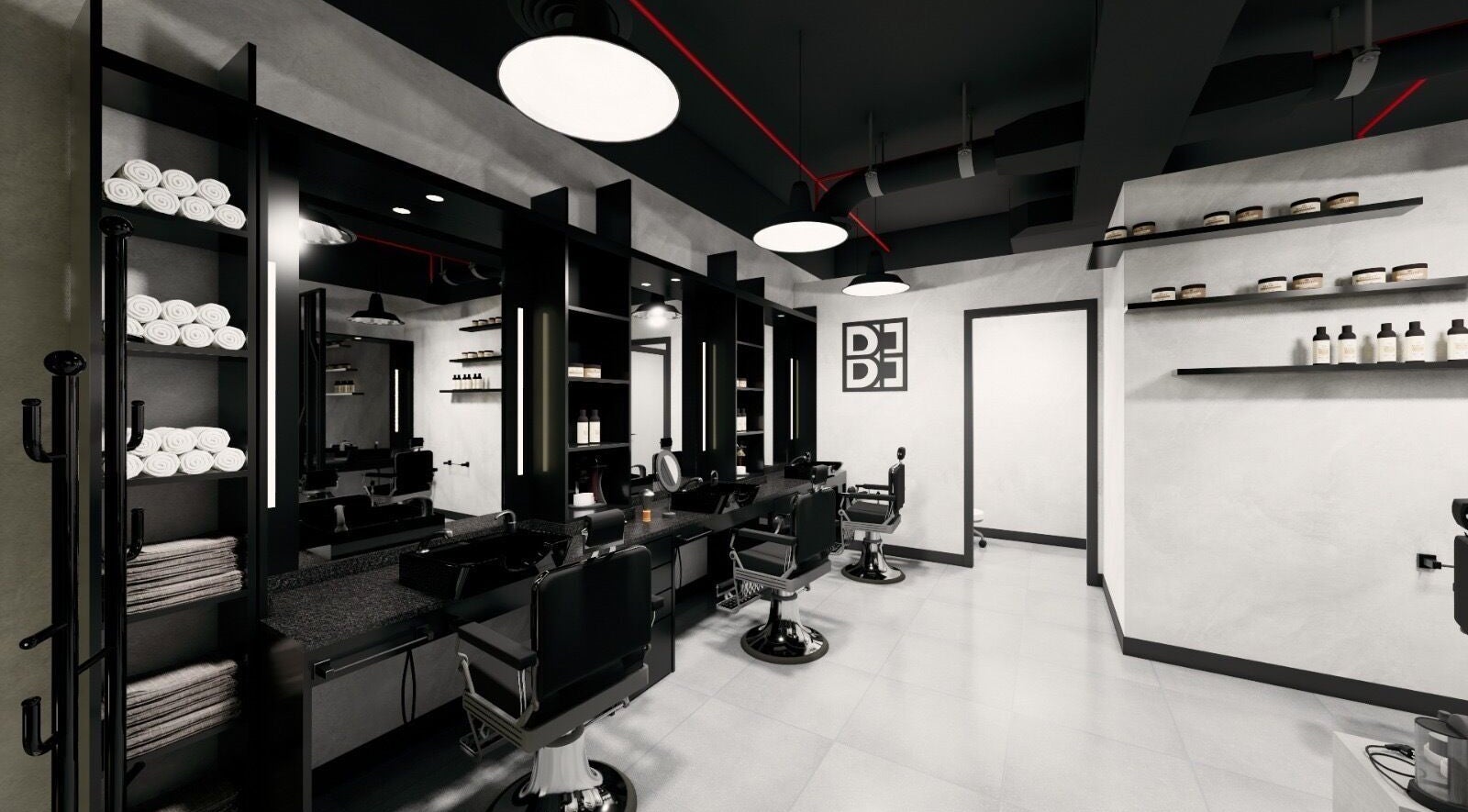 Modern interior of Budz and Broz Barbershop in Dubai, Dubai, AE with sleek black chairs and elegant shelving.