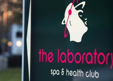 "Holistic Calibration" sign at London, England, GB. Elegant spa logo with serene backdrop.