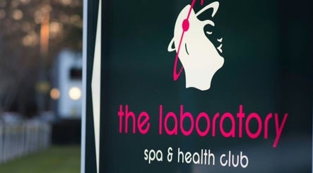 "Holistic Calibration" sign at London, England, GB. Elegant spa logo with serene backdrop.