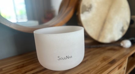 White sound bowl at Havana Wellness Hut in Port Elliot, South Australia, AU, resting on a wooden surface.
