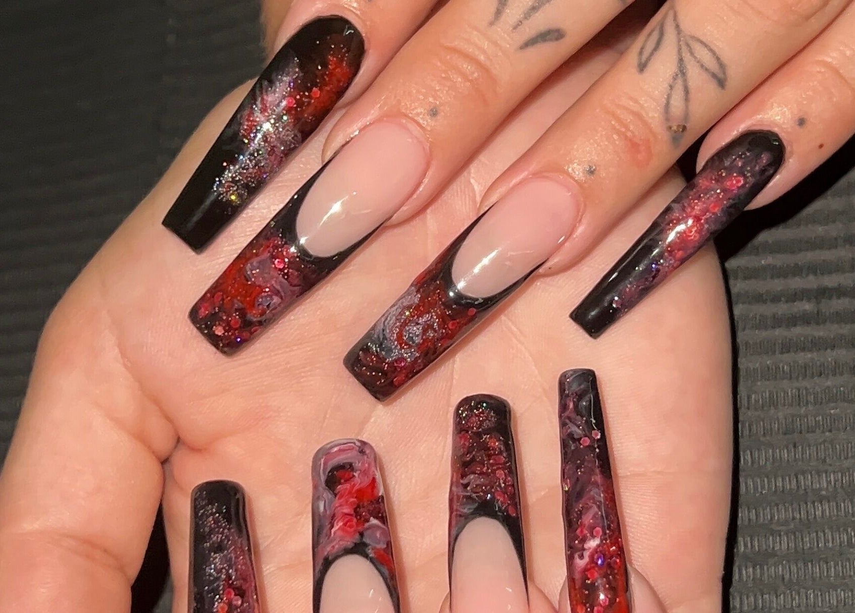 Intricate black and red nail art at Nevar Beauty, Richlands, Queensland, AU.