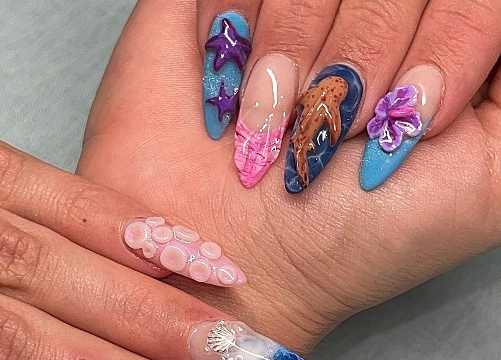 Intricate ocean-inspired nail art at Nevar Beauty, Richlands, Queensland, AU.