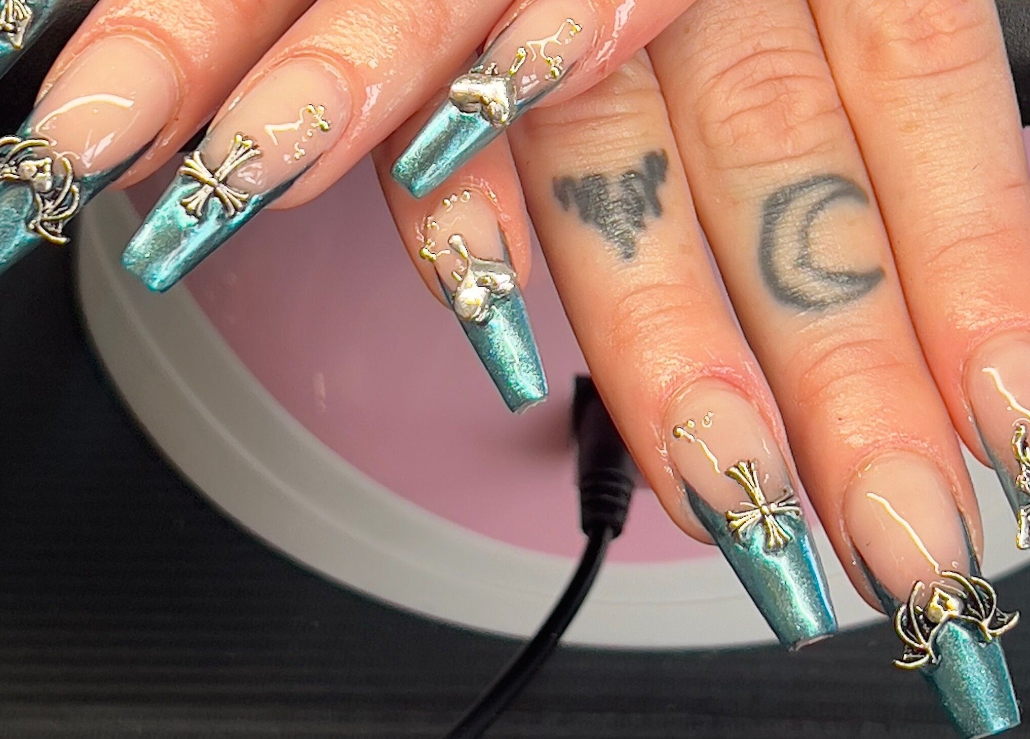 Intricate turquoise nail art at Nevar Beauty, Richlands, Queensland, AU, showcasing exquisite design.