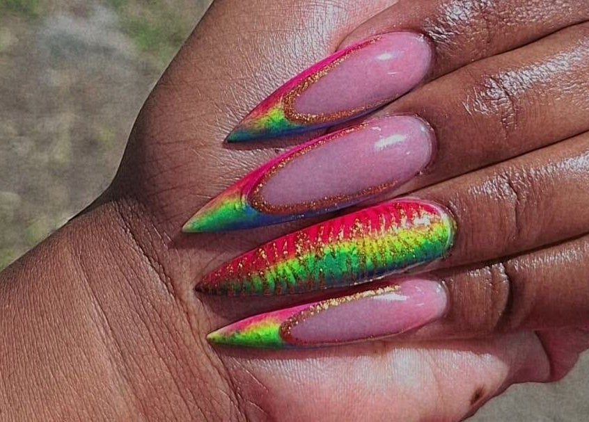 Vibrant rainbow stiletto nails at J's fullhousebeauty, Saint Philip, Bridgetown, BB. Perfect for a bold style.
