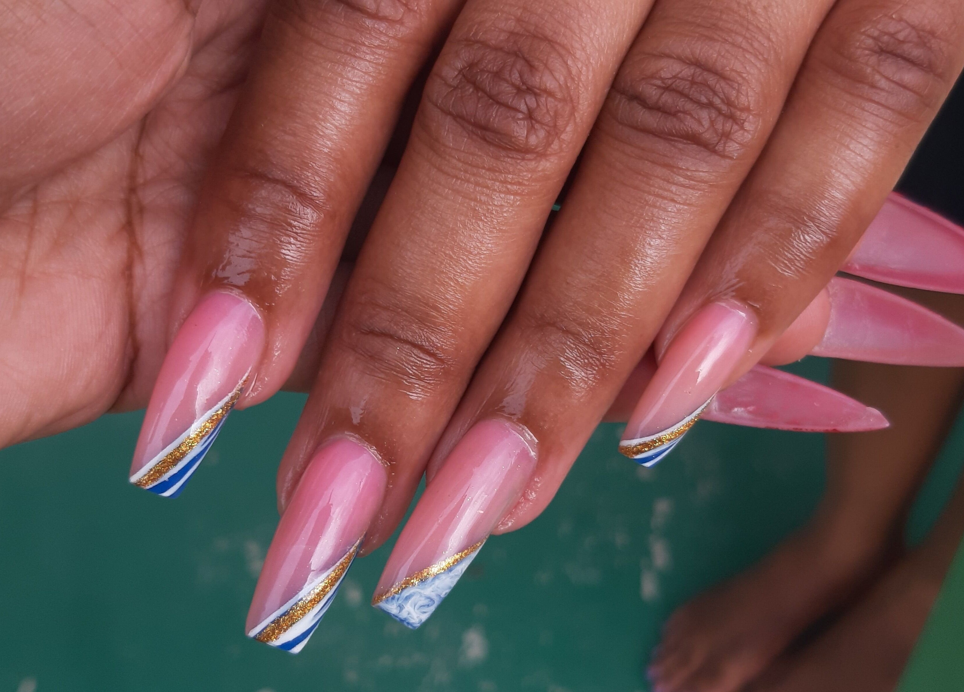 Stylish pink and gold nail art design at J's fullhousebeauty, Saint Philip, Bridgetown, BB.