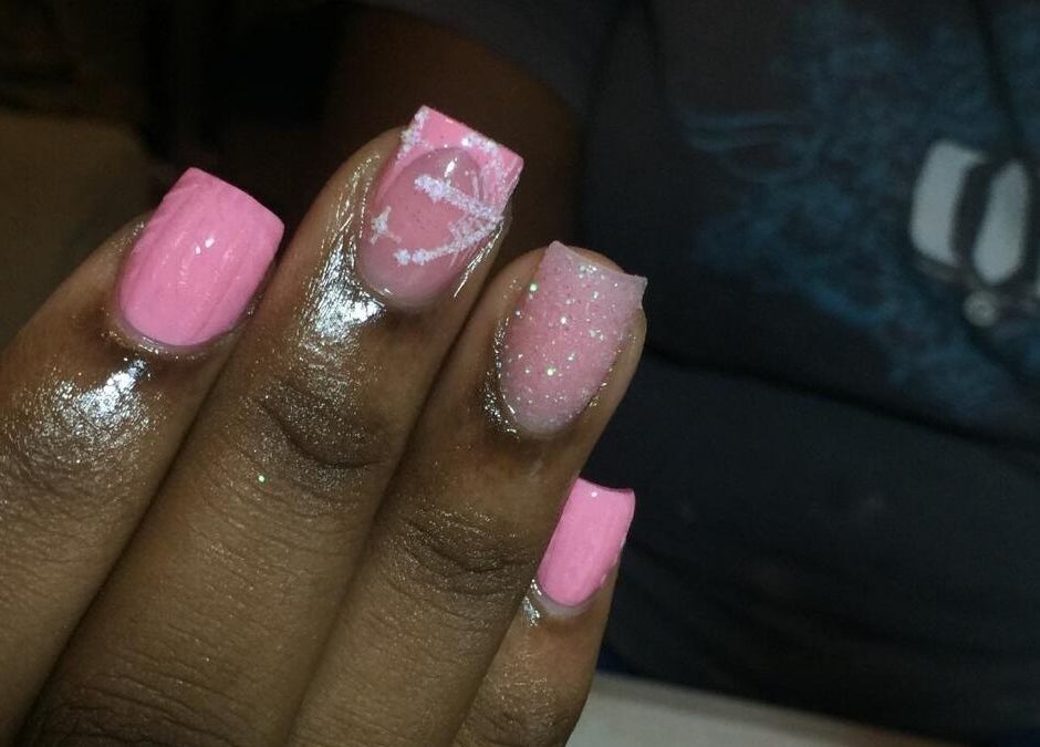 Stylish pink nails with art at J's fullhousebeauty, Saint Philip, Bridgetown, BB.