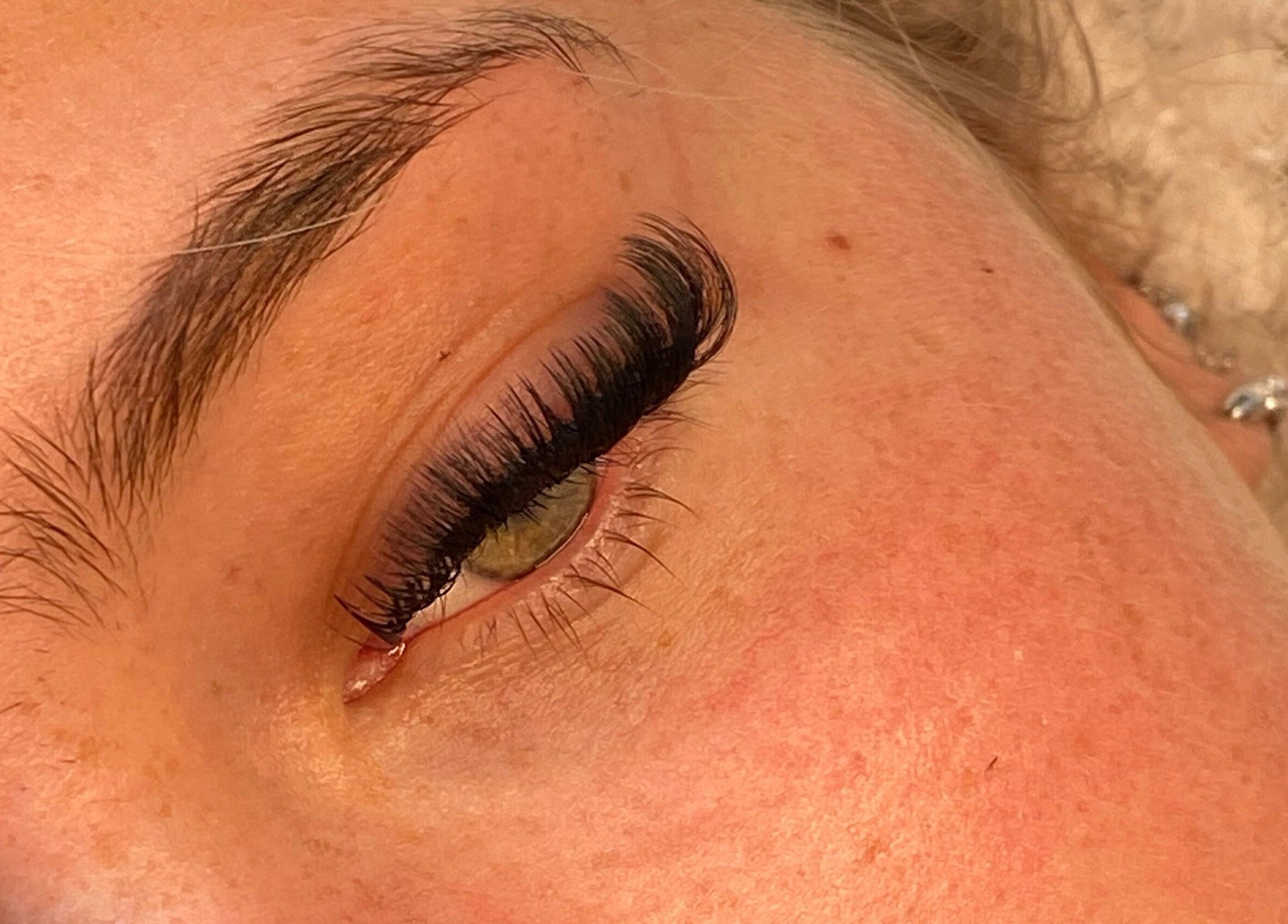 Close-up of expertly applied eyelash extensions at TheAngelSalon, Tonbridge, England, GB.