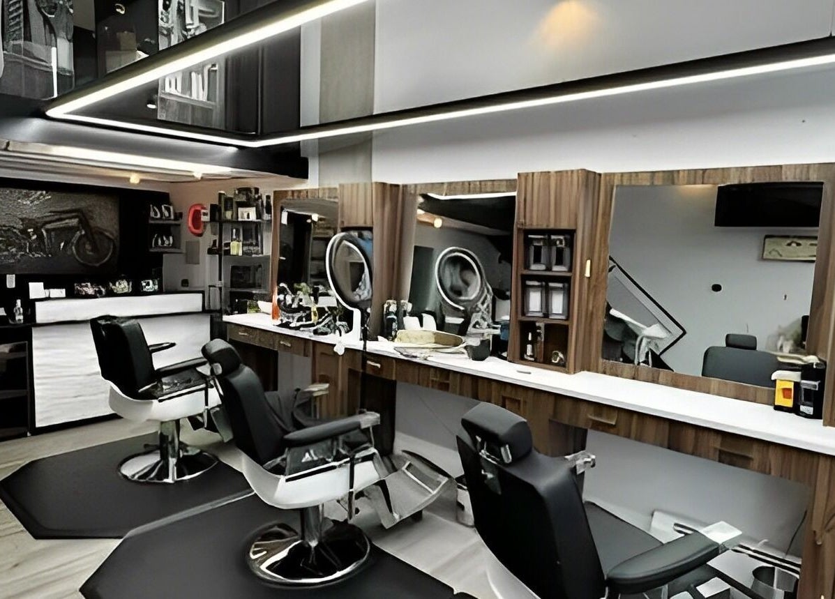 Modern interior of Ev Cut Barbershop in Calgary, Alberta, CA with stylish chairs and mirrors.