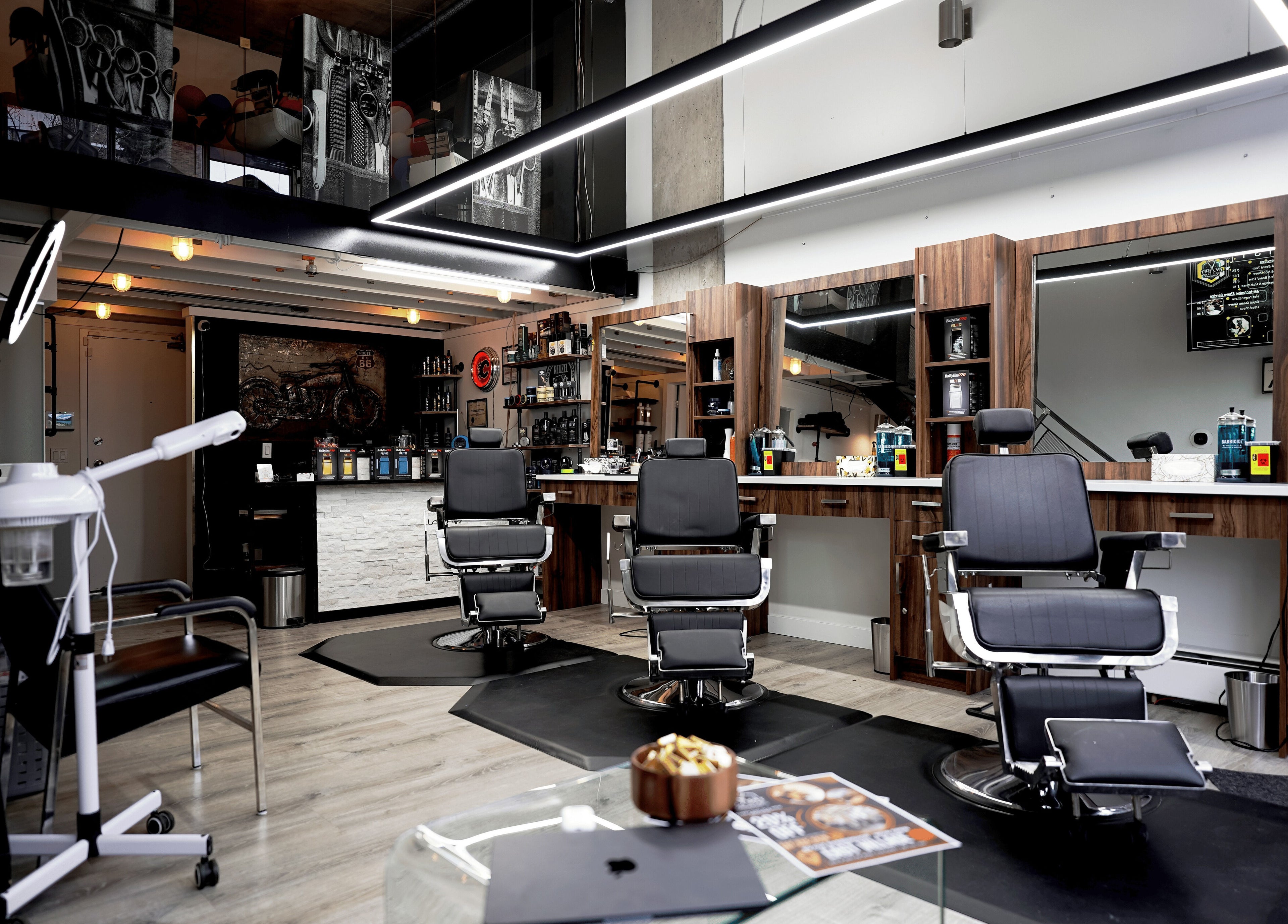 Stylish interior of Ev Cut Barbershop in Calgary, Alberta, CA showcasing barber chairs and modern decor.