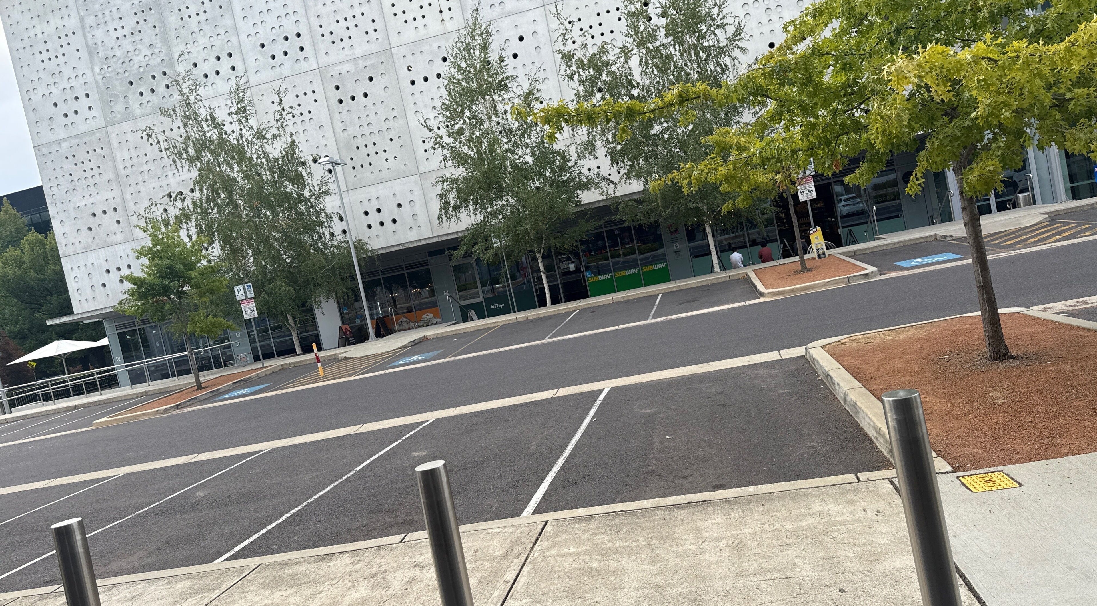 Exterior view of Velvet Touch Hair & Beauty in Barton, ACT, AU with modern architecture and trees.
