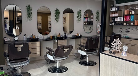Velvet Touch Hair & Beauty in Barton features elegant styling stations with modern decor and lush greenery.