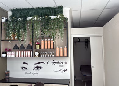 Shelves with plants and beauty products at Velvet Touch Hair & Beauty, Barton, Australian Capital Territory, AU.
