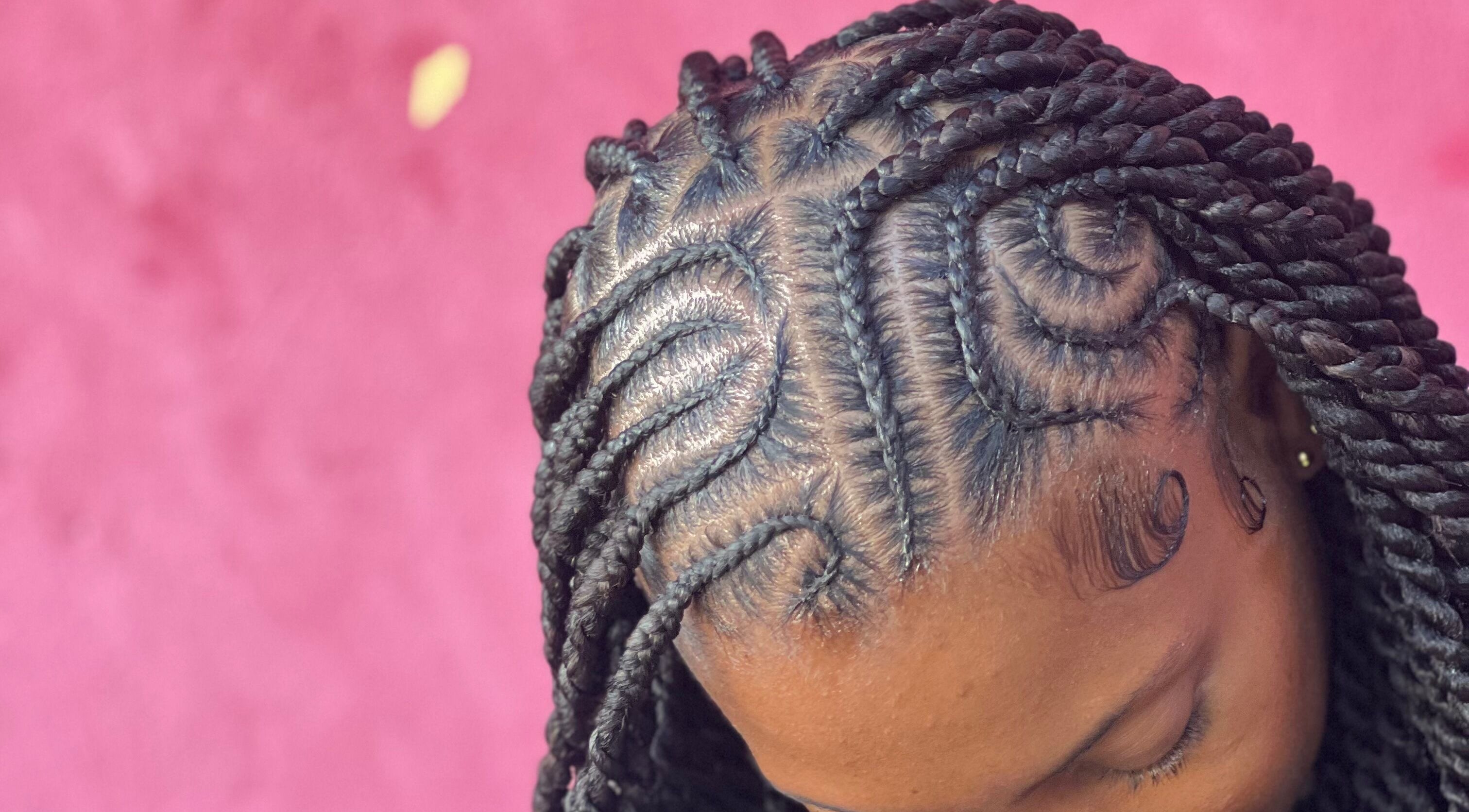 Intricate braided hairstyle at Locsby Princess, Kingstown, St. George, VC.